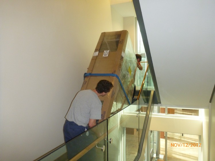 Movers carefully handling items