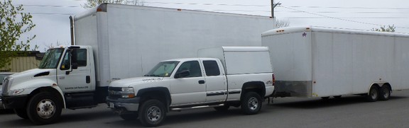 Moving truck with attached trailer